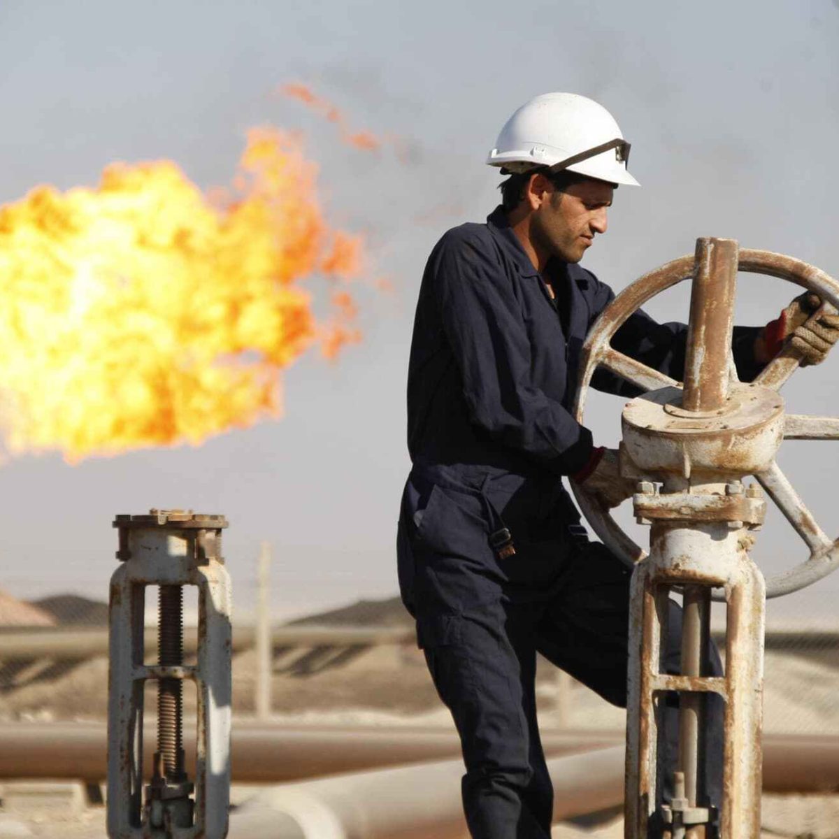 worker adjusting valve of an oil pipe